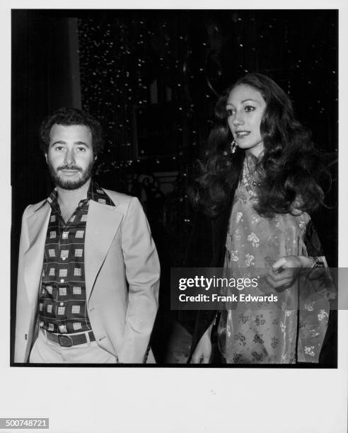 Producer David Geffen and actress Marisa Berenson, at the Golden Apple Awards, Beverly Hills Hotel, December 1975.