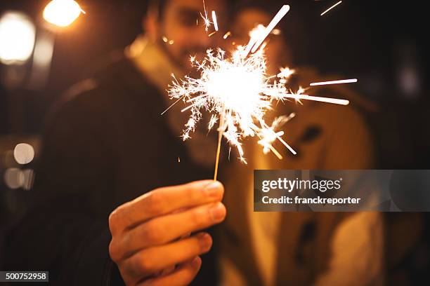 enjoy the new year's eve party - sparklers stock pictures, royalty-free photos & images