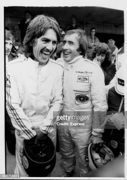 Ex-Beatles guitarist George Harrison and racing driver Jackie Stewart, Donington Park, England, 1979.