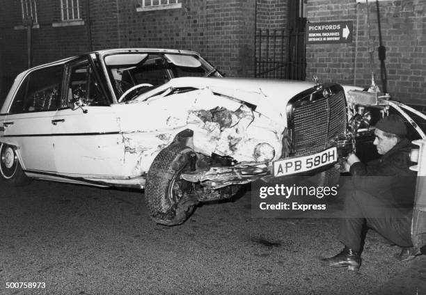 The damaged remains of the Mercedes driven by musician George Harrison, following his crash on the M4, England, February 29th 1972.