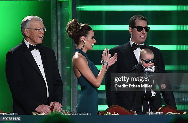 Team owner Joe Gibbs, Samantha Busch, her husband, NASCAR Sprint Cup Series champion Kyle Busch, and their son Brexton Busch are introduced at the...