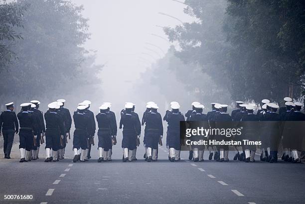 The Coast Guard marching contingent passes through a road during the full dress rehearsal for the Republic Day Parade 2016 on a cold foggy morning...