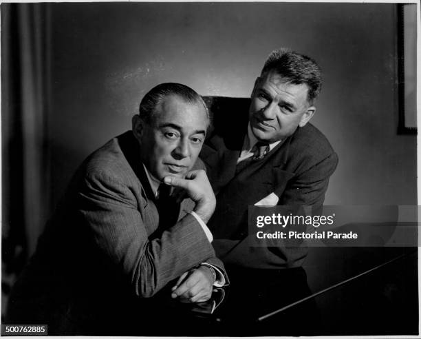 Portrait of music composers Richard Rodgers and Oscar Hammerstein at a piano, during the development of their new musical 'Pipe Dream', 1955.