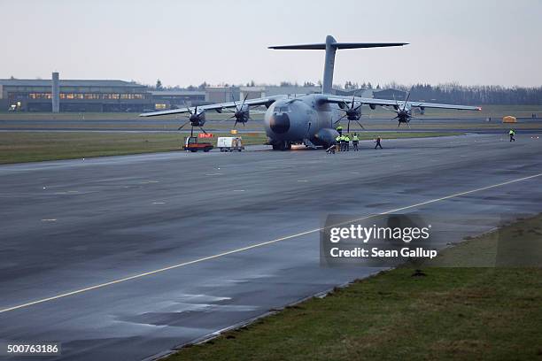 Crews load a Luftwaffe A-400M plane transporting 40 Bundeswehr members and their equipment shortly before takeoff for Incirlik airbase in Turkey as...