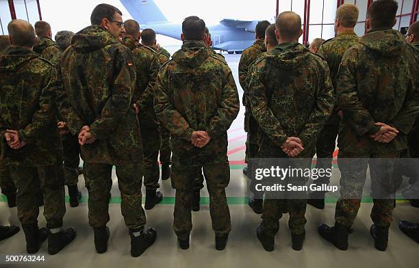 Forty members of the Bundeswehr, the German armed forces, attend a ceremony shortly before boarding a Luftwaffe A-400M transport plane destined for...