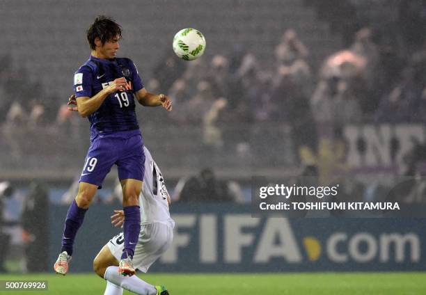 Sanfrecce Hiroshima defender Sho Sasaki heads the ball beside Auckland City FC midfielder Kim Dae-Wook during their FIFA Club World Cup football...