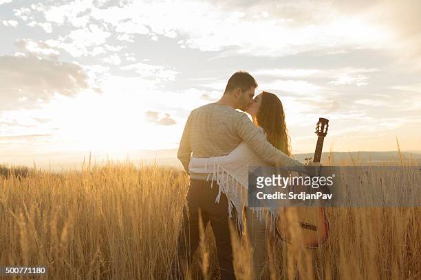 sunset for two - country and western music stock pictures, royalty-free photos & images