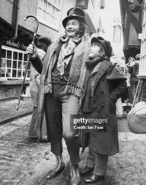 Actors Roy Dotrice and Simon Bell, in costume on the set of the television series 'Dickens of London', York, England, 1976.