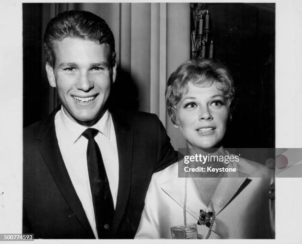 Actor Ryan O'Neill, with his wife Joanna Moore, at the Hollywood Women's Press Club, California, circa 1965.