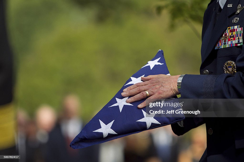 Soldier folding flag at military funeral