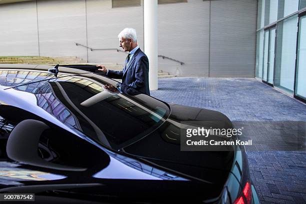 Volkswagen Group Chairman Matthias Mueller goes to his car after a press conference to announce the latest update in the company's handling of the...