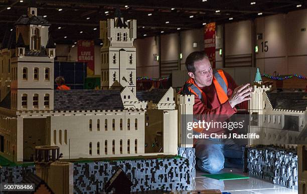 Lego builder Eric Philhan places a dragon on top of Hogwarts School, from the Harry Potter series, made out of 250,000 bricks over 800 hours at ExCel...