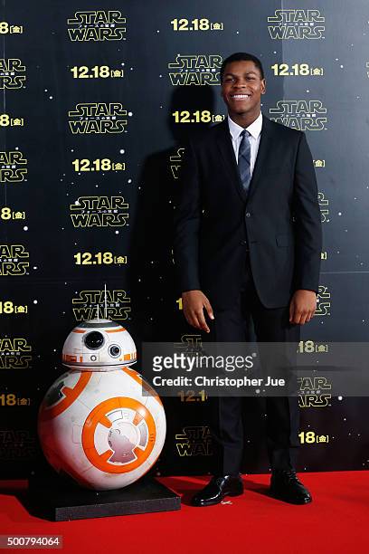 John Boyega poses with BB-8 at the 'Star Wars: The Force Awakens' fan event at the Roppongi Hills on December 10, 2015 in Tokyo, Japan.