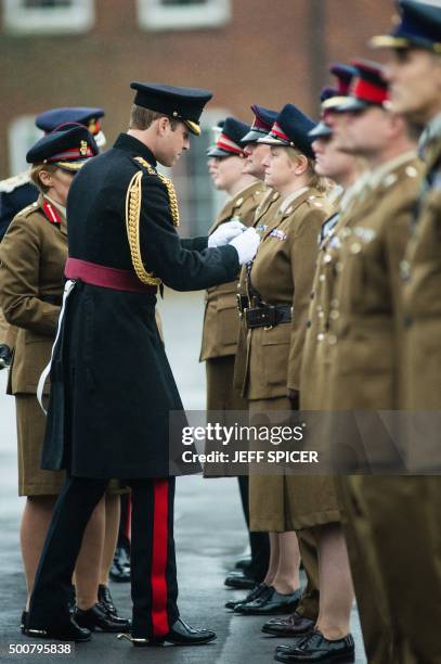 Britain's Prince William, Duke of Cambridge, presents the Government Ebola Medal for Service in West Africa during the 2014/15 Ebola outbreak to...