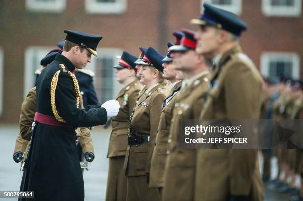 Britain's Prince William, Duke of Cambridge, presents the Government Ebola Medal for Service in West Africa during the 2014/15 Ebola outbreak to...