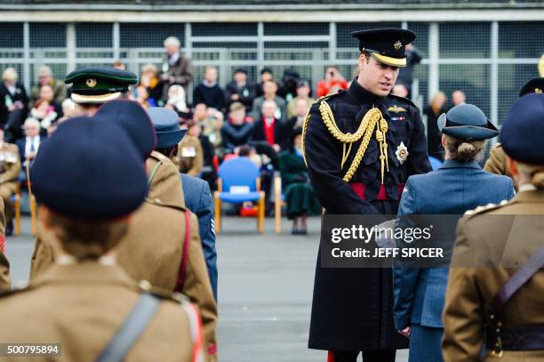 Britain's Prince William, Duke of Cambridge, presents the Government Ebola Medal for Service in West Africa during the 2014/15 Ebola outbreak to...