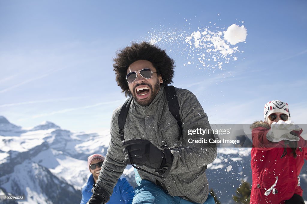 Friends enjoying snowball fight