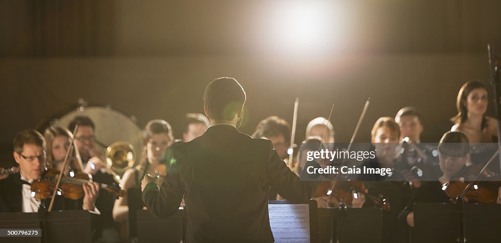 Conductor leading orchestra