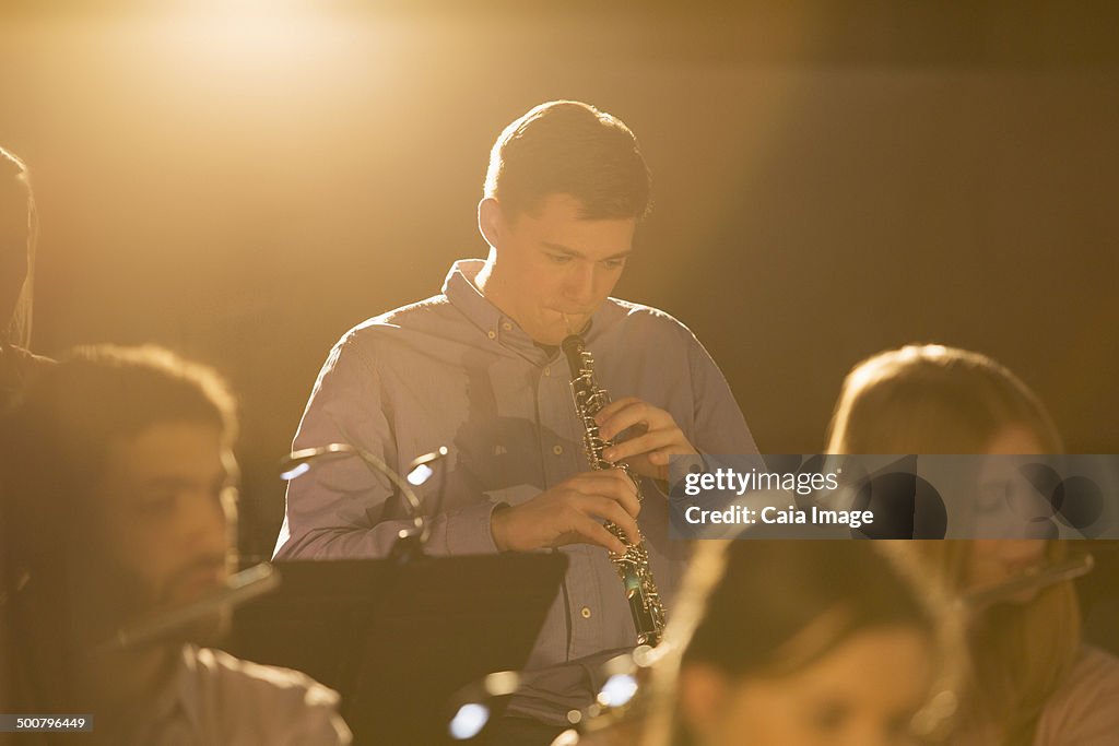 Oboist performing in orchestra