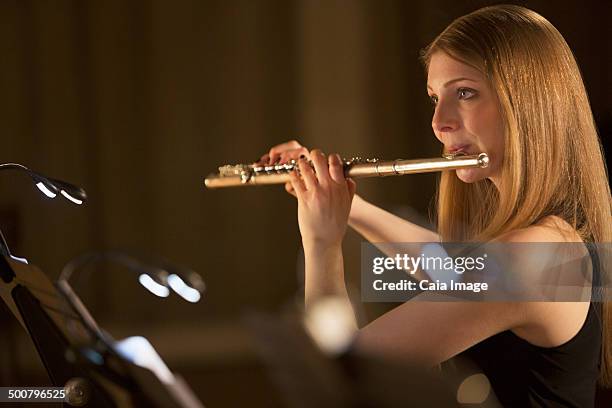 flutist performing - soloist stock-fotos und bilder