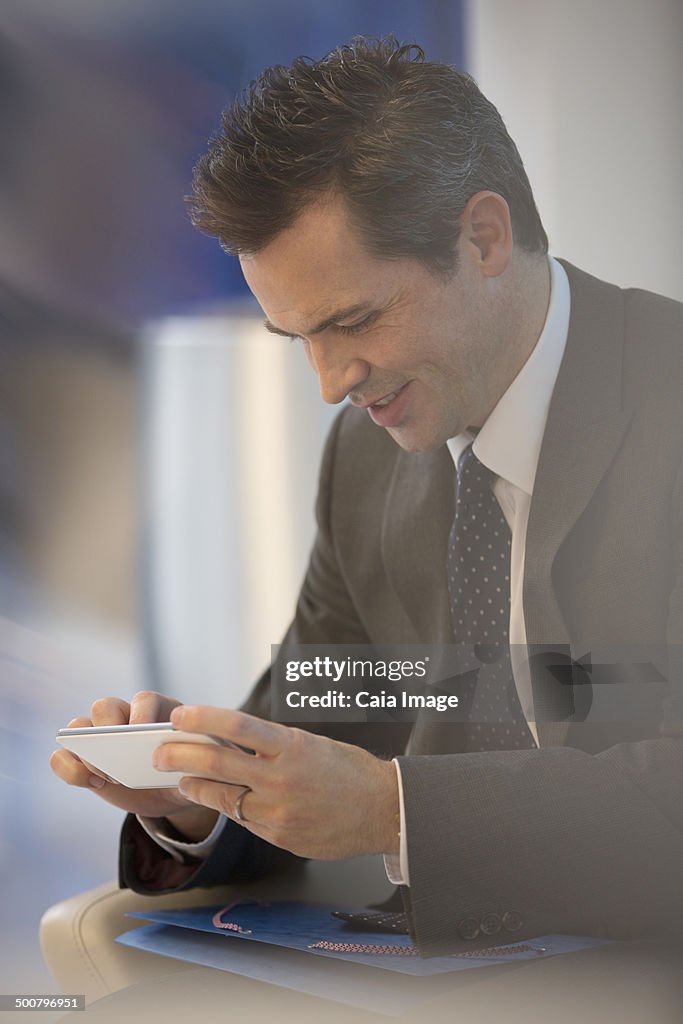 Businessman using cell phone