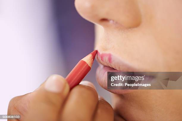 the outline of a perfect pout - lip liner stock pictures, royalty-free photos & images