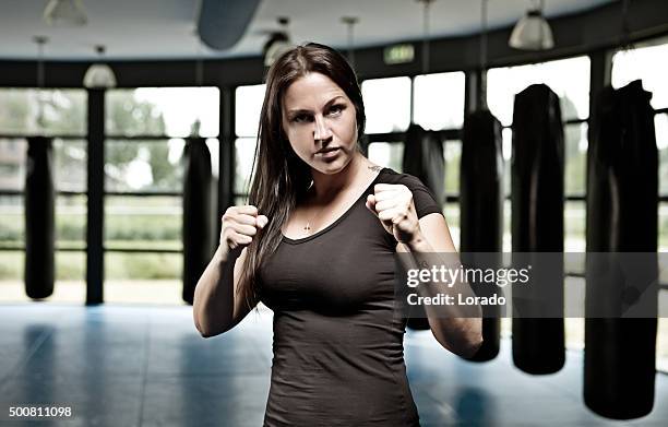 female fighter during training session - girl martial arts stock pictures, royalty-free photos & images