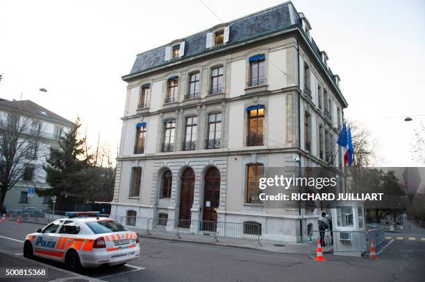 Police car is pictured in front of the French Consulate in Geneva on December 10, 2015 in Geneva after Police in Geneva raised the alert level and...