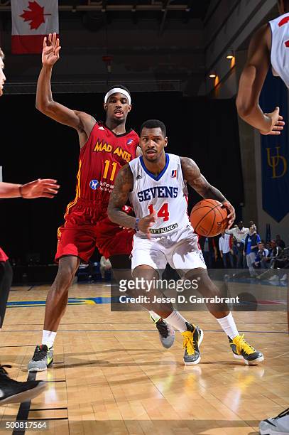 Sean Kilpatrick of the Deleware 87ers drives against CJ Fair of the Fort Wayne Mad Ants at the Bob Carpenter Center on December 9, 2015 in Newark,...
