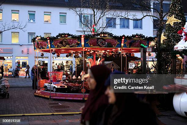 People walk in the city center on December 10, 2015 in Wolfsburg, Germany. Wolfsburg is the base for the car manufactury Volkswagen group. Volkswagen...