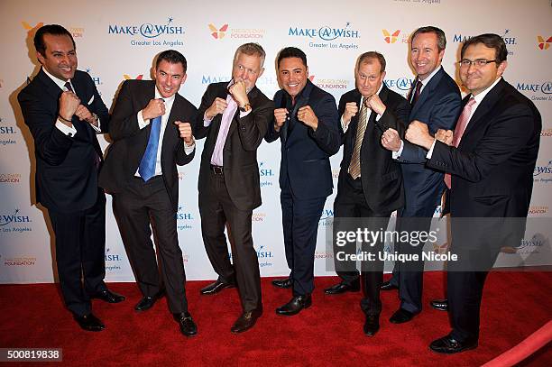 Oscar De la Hoya and event auctioneers arrive at the Make-A-Wish Greater Los Angeles Annual Wishing Well Winter Gala at the Beverly Wilshire Four...