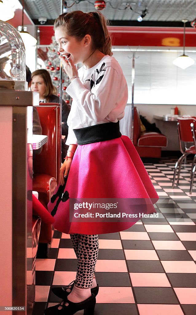 Students dress in 1950s attire at diner