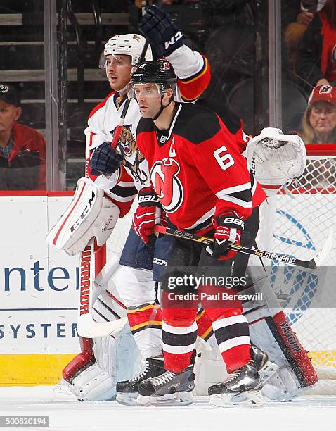 Andy Greene of the New Jersey Devils sets up in front of the net during an NHL hockey game against the Florida Panthers at Prudential Center on...
