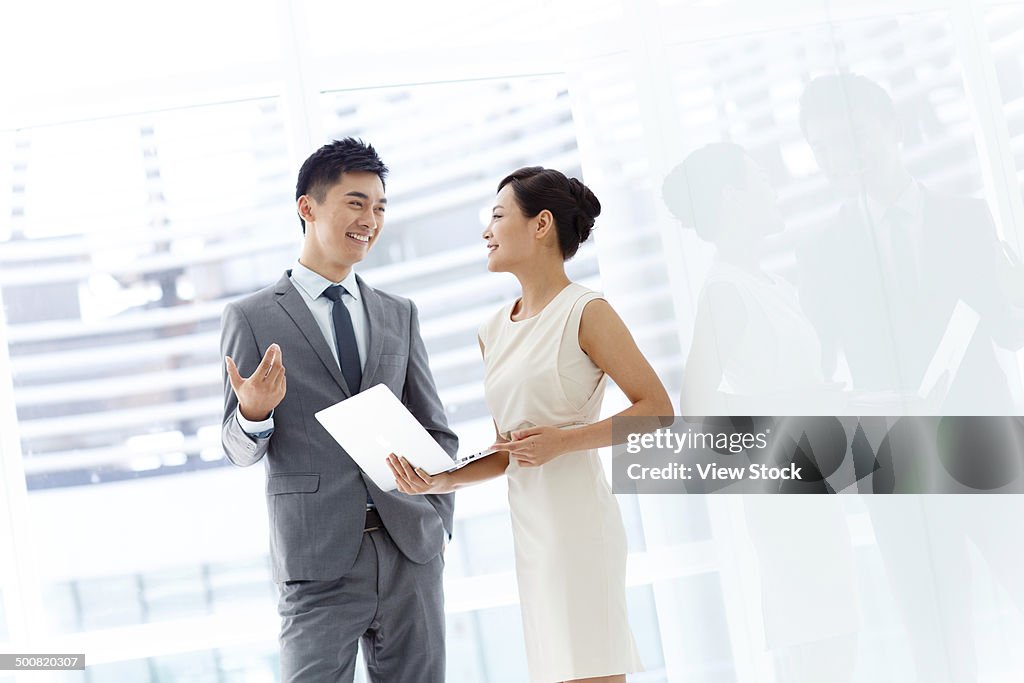 Young businessman and businesswoman