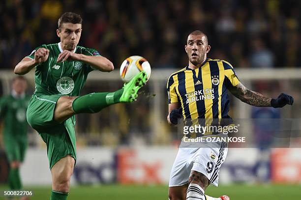 Celtic's Jozo Simunovic vies with Fenerbahce's Fernandao during the UEFA Europa League football match between Fenerbahce and Celtic at Fenerbahce...