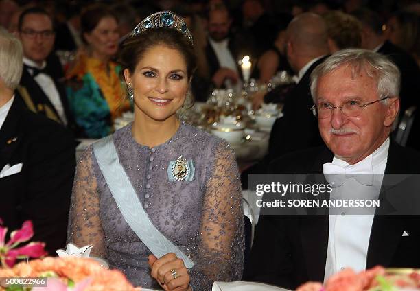 Sweden's Princess Madeleine and Nobel Chemistry Prize 2015 co-winner US Paul Modrich attend the 2015 Nobel Banquet at the Stockholm City Hall on...