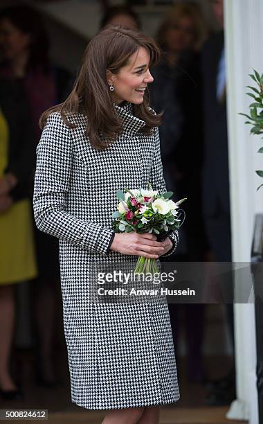 Catherine, Duchess of Cambridge, wearing a 'Rubik' coat by Reiss, attends an official visit to the Action on Addiction Centre for addiction treatment...