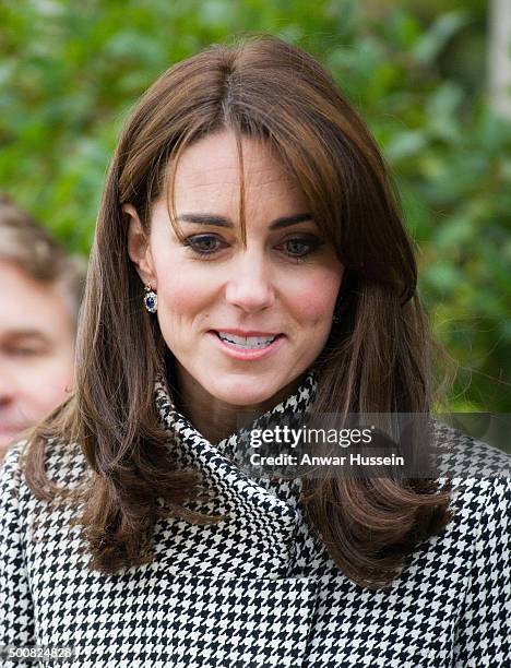 Catherine, Duchess of Cambridge, wearing a 'Rubik' coat by Reiss, attends an official visit to the Action on Addiction Centre for addiction treatment...