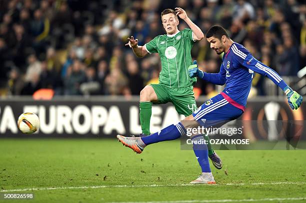 Fenerbahce's goalkeeper Fabiano kicks the ball next to Celtic's Callum McGregor during the UEFA Europa League football match between Fenerbahce and...