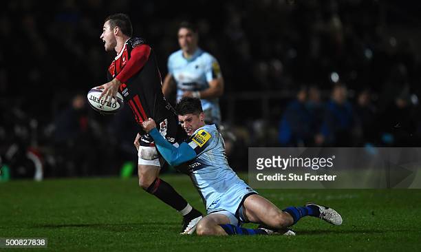 Henry Trinder of Gloucester is tackled by Ben Howard of Worcester during the European Rugby Challenge Cup match between Worcester Warriors and...