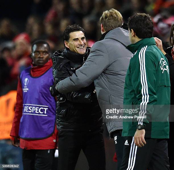 Jurgen Klopp manager of Liverpool embrases Didier Tholot manager of FC Sion at the end of the UEFA Europa League match between FC Sion and Liverpool...
