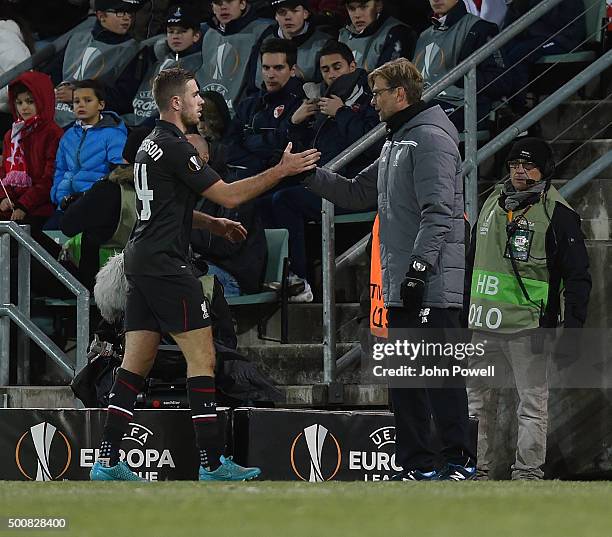 Jurgen Klopp manager of Liverpool shakes hands with Jordan Henderson during the UEFA Europa League match between FC Sion and Liverpool FC at Estadio...