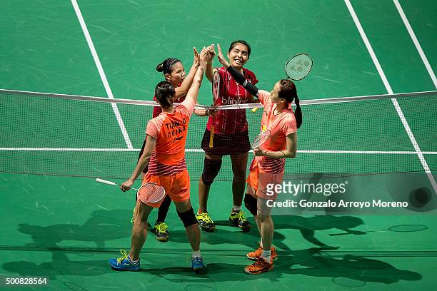 Nitya Krishinda Maheswari and Greysia Polii of India touch hands with Tian Qing and Zhao Yunley of China after their Women,s Doubles match during of...