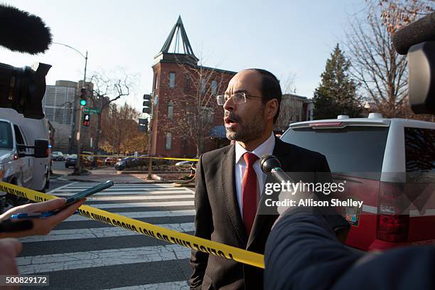 Nihad Awad, the Executive Director and co-founder of the Council on American-Islamic Relations , speaks to the media as fire and hazmat crews arrive...