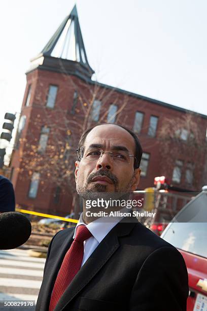 Nihad Awad, the Executive Director and co-founder of the Council on American-Islamic Relations , speaks to the media as fire and hazmat crews arrive...