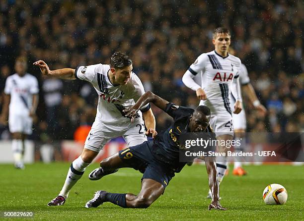 Lacina Traore of AS Monaco FC is tackled by Kevin Wimmer of Tottenham Hotspur FC during the UEFA Europa League group J match between Tottenham...