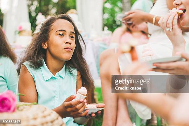 girls at a garden party with dessert table - tea party stock pictures, royalty-free photos & images