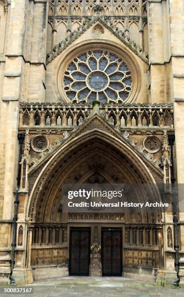 Bristol Cathedral, in the city of Bristol, England, Founded in 1140, presents a harmonious view of tall Gothic windows and pinnacle skyline that...