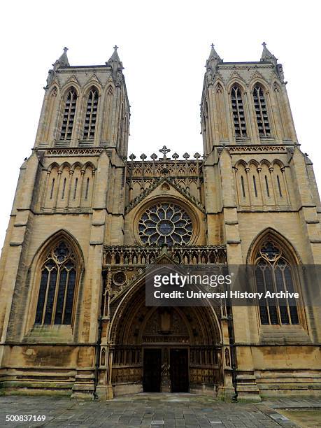 Bristol Cathedral, in the city of Bristol, England, Founded in 1140, presents a harmonious view of tall Gothic windows and pinnacle skyline that...