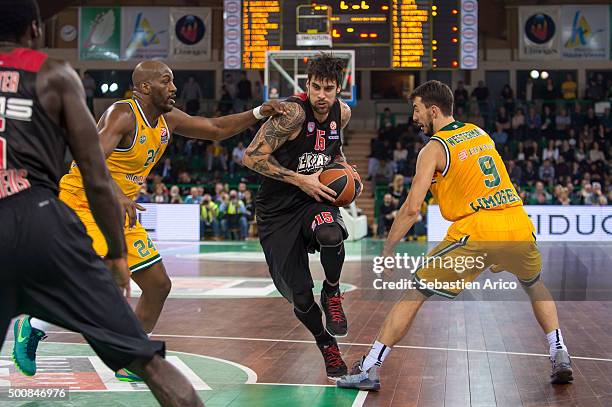 Georgios Printezis, #15 of Olympiacos Piraeus competes with Ali Traore, #24 of Limoges CSP and Leo Westermann, #9 of Limoges CSP during the Turkish...